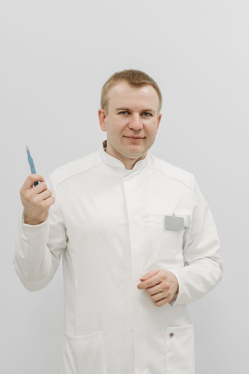Portrait of Dr. Julian Reyes in a white clinical coat